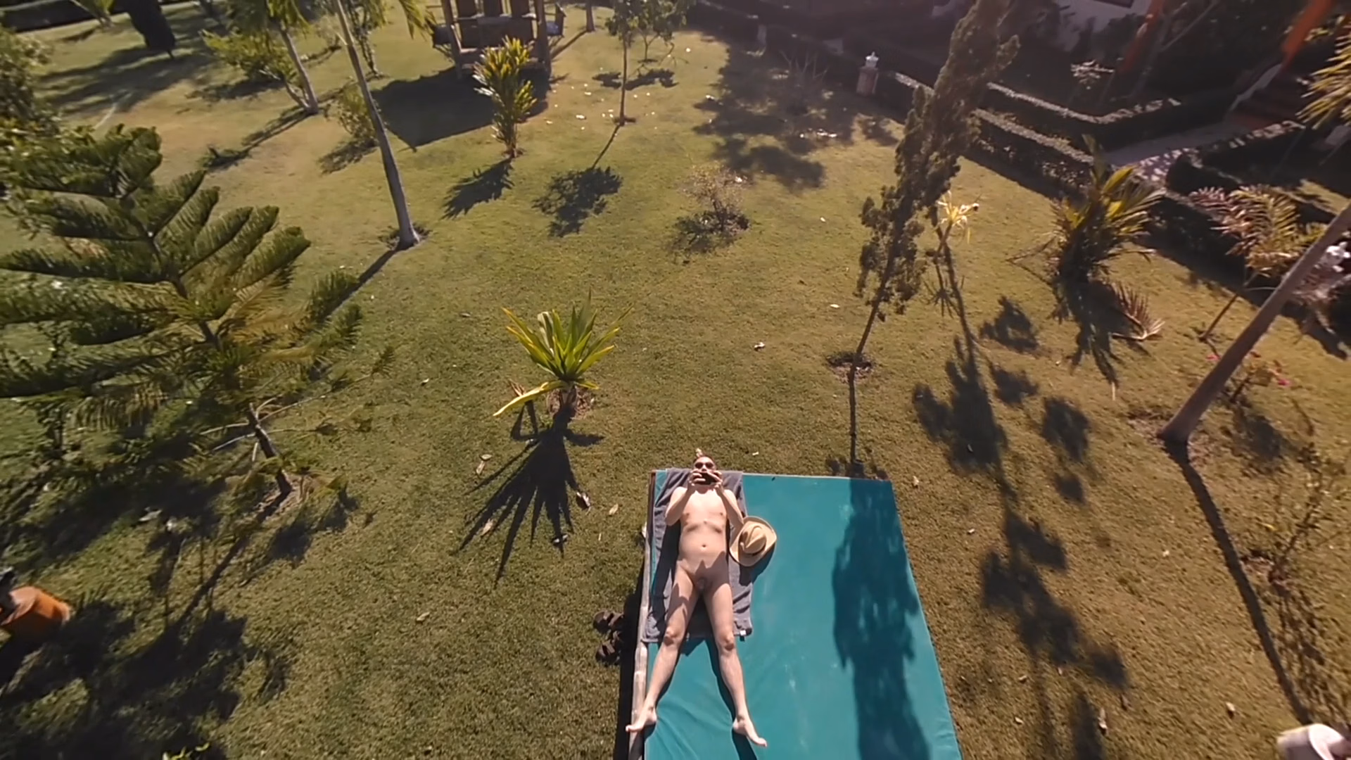 Nude sunbathing departure angle drone shot